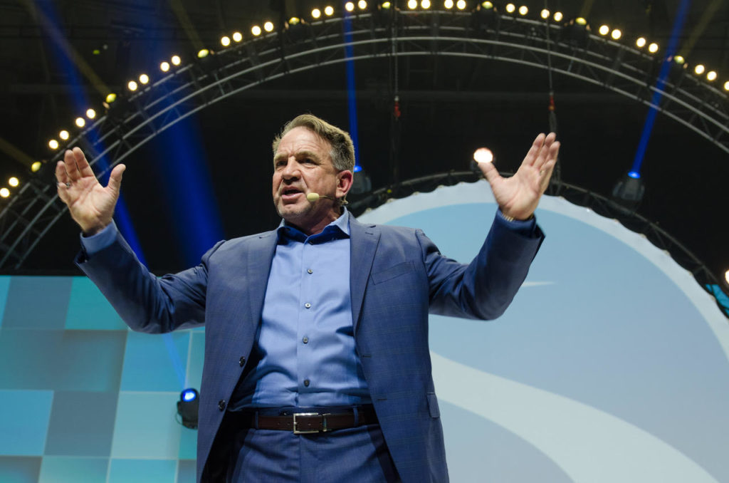 Photo of Presley Swagerty speaking wiht hands raised